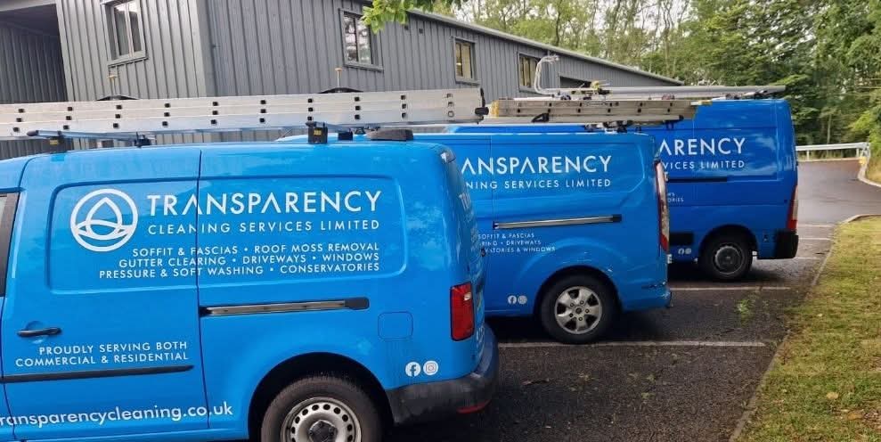Three Transparency Cleaning vans parked together